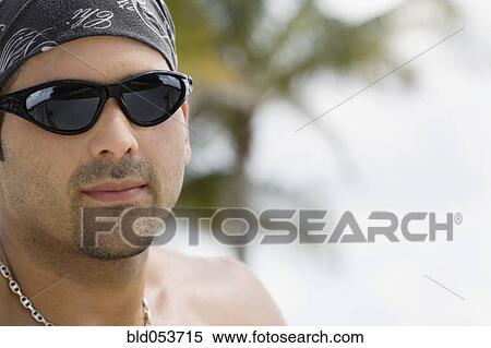 Hispanic man wearing sunglasses View Large Photo Image Stock Photography - Hispanic man wearing sunglasses. Fotosearch