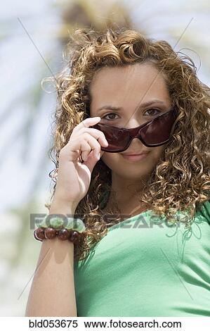 Hispanic teenaged girl wearing sunglasses View Large Photo Image Stock Photography - Hispanic teenaged girl wearing sunglasses. Fotosearch