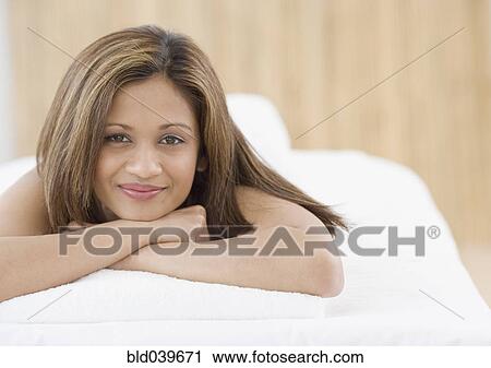 Indian woman laying on spa table View Large Photo Image Stock Image - Indian woman laying on spa table. Fotosearch