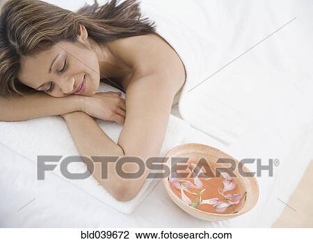 Indian woman laying on spa table View Large Photo Image Stock Image - Indian woman laying on spa table. Fotosearch