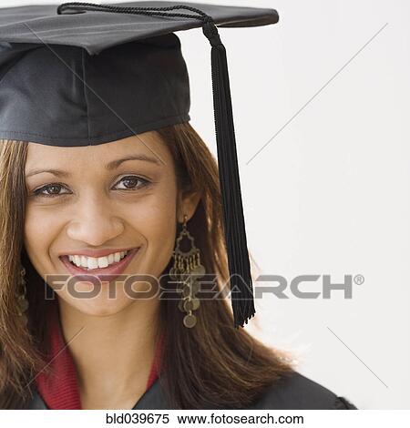 Indian woman wearing graduation cap and gown View Large Photo Image Stock Photography - Indian woman wearing graduation cap and gown. Fotosearch