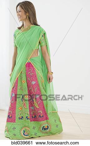 Stock Image - Indian woman wearing traditional dress. Fotosearch