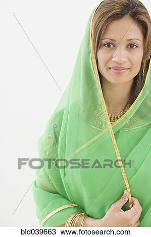 Stock Image - Indian woman wearing traditional dress. Fotosearch