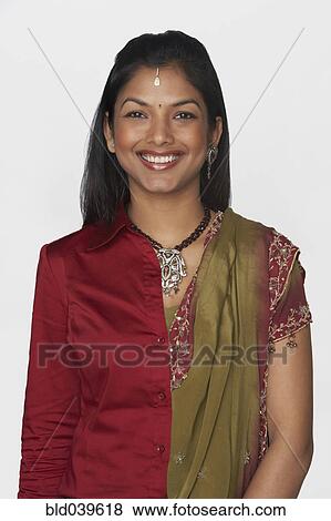 Indian woman wearing traditional dress and modern attire View Large Photo Image Stock Photo - Indian woman wearing traditional dress and modern attire. Fotosearch