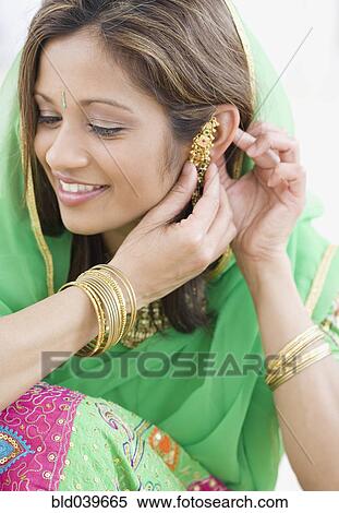 Indian woman wearing traditional dress View Large Photo Image Stock Photography - Indian woman wearing traditional dress. Fotosearch