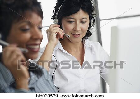 Stock Photo - Kazakh businesswoman wearing headset. Fotosearch