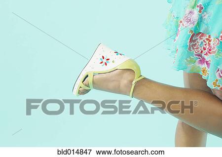 Low section of woman in dress and high heels View Large Photo Image Stock Photo - Low section of woman in dress and high heels. Fotosearch