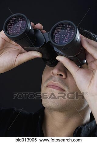 Stock Photography - Man looking through binoculars. Fotosearch