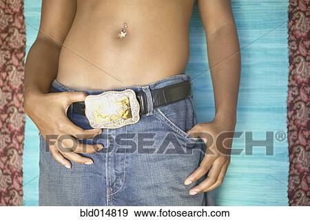 Mid section of woman with pierced navel View Large Photo Image Stock Photo - Mid section of woman with pierced navel. Fotosearch