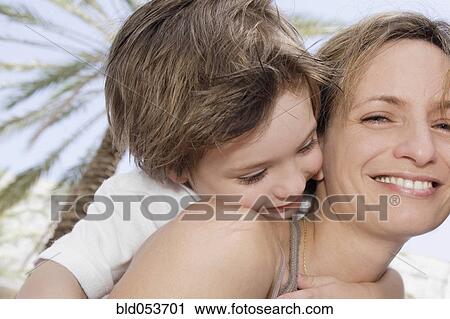 Mother and son hugging View Large Photo Image Stock Image - Mother and son hugging. Fotosearch