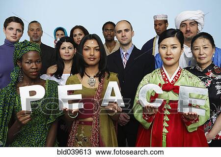 Stock Image - Multi-ethnic people holding the word PEACE . Fotosearch