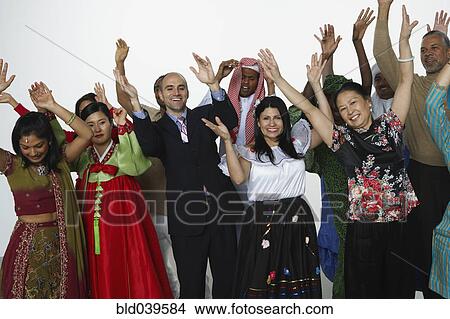 Picture - Multi-ethnic people in traditional dress cheering. Fotosearch