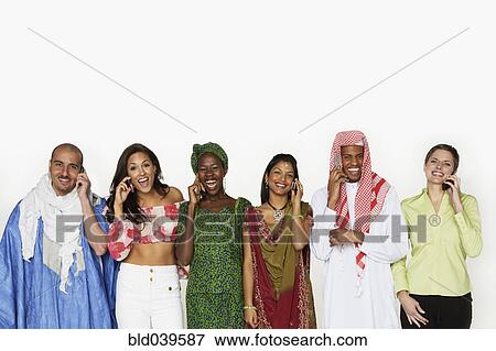 Stock Photo - Multi-ethnic people in traditional dress using cell phones. Fotosearch