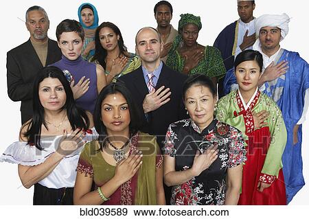 Stock Photo - Multi-ethnic people in traditional dress holding hand on heart. Fotosearch
