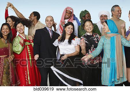 Stock Photo - Multi-ethnic people in traditional dress dancing. Fotosearch
