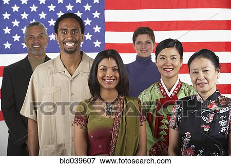 Multi-ethnic people standing in front of American flag View Large Photo Image Stock Photo - Multi-ethnic people standing in front of American flag. Fotosearch