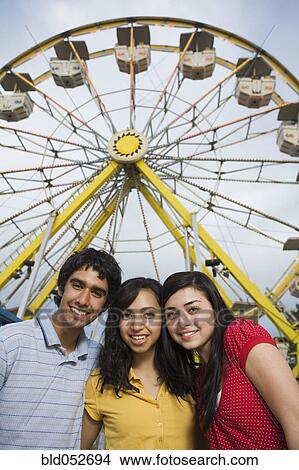 Picture - Multi-ethnic teenaged friends at carnival. Fotosearch