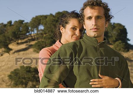 Portrait of couple hugging View Large Photo Image Stock Photo - Portrait of couple hugging. Fotosearch
