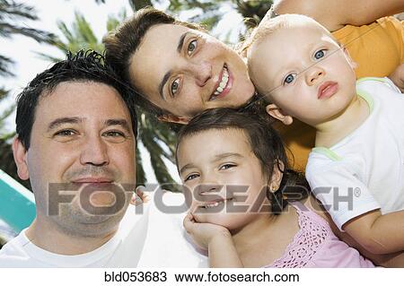 Stock Image - Portrait of family with two children. Fotosearch