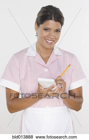 Stock Photo - Portrait of waitress taking order. Fotosearch
