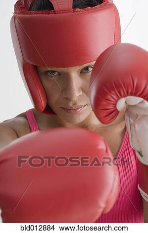 Picture - Portrait of woman in boxing gear. Fotosearch