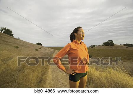 Portrait of woman jogging in country View Large Photo Image Stock Photograph - Portrait of woman jogging in country. Fotosearch