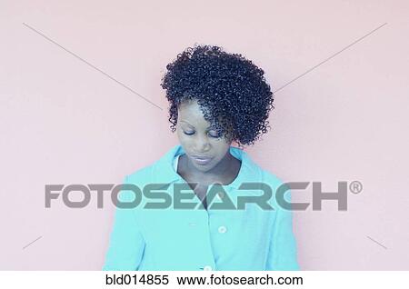 Stock Photography - Portrait of woman looking down. Fotosearch
