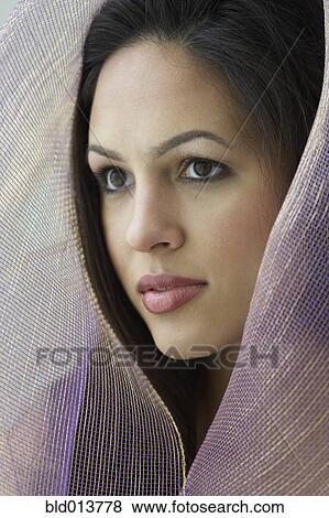 Stock Photo - Portrait of woman with scarf over head. Fotosearch