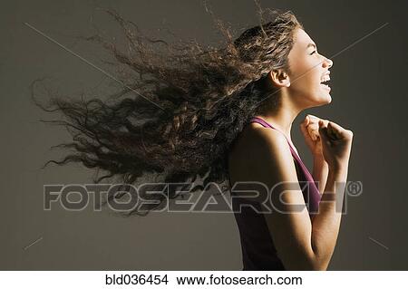 Profile of Asian woman cheering View Large Photo Image Picture - Profile of Asian woman cheering. Fotosearch