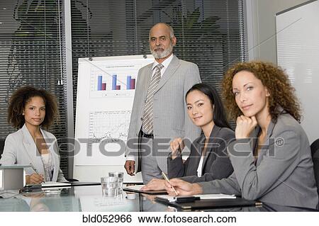 Senior African businessman giving presentation View Large Photo Image Stock Photograph - Senior African businessman giving presentation. Fotosearch
