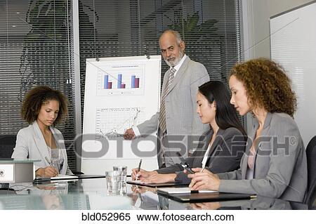 Senior African businessman giving presentation View Large Photo Image Stock Photography - Senior African businessman giving presentation. Fotosearch