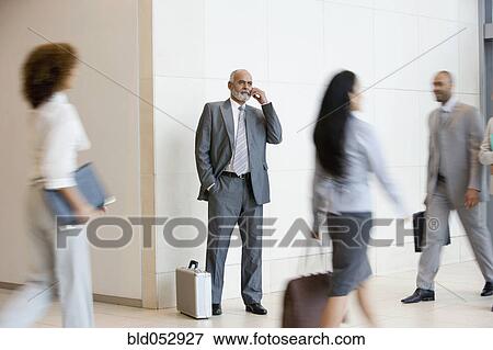 Senior African businessman talking on cell phone View Large Photo Image Stock Photo - Senior African businessman talking on cell phone. Fotosearch