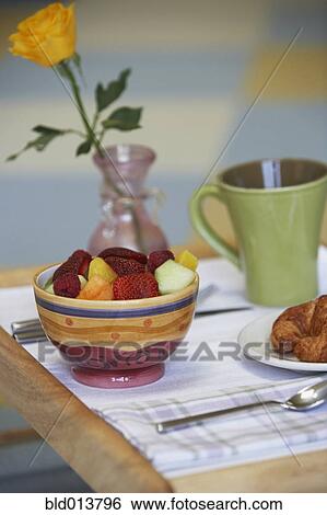 Stock Photograph - Still life of fruit and roll. Fotosearch