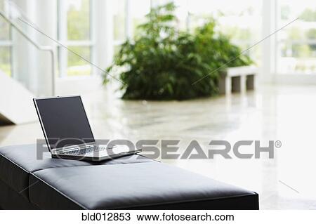 Still life of laptop computer on leather seat View Large Photo Image Stock Image - Still life of laptop computer on leather seat. Fotosearch