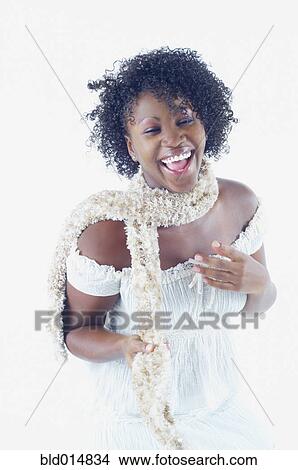 Woman laughing wearing scarf View Large Photo Image Picture - Woman laughing wearing scarf. Fotosearch