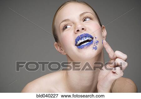 Stock Photo - Woman with sprinkles on lips. Fotosearch