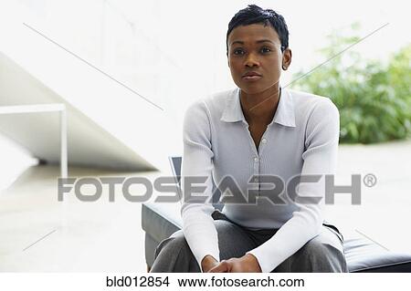 Picture - Young woman with pensive expression. Fotosearch