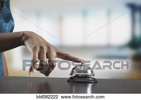 Black woman ringing reception desk bell View Large Photo Image Stock Image - Black woman ringing reception desk bell. Fotosearch