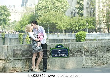 Caucasian couple kissing on Pont de L'Archeveche View Large Photo Image Stock Image - Caucasian couple kissing on Pont de L'Archeveche. Fotosearch
