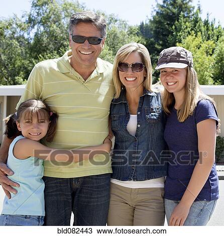 Stock Image - Caucasian family smiling. Fotosearch