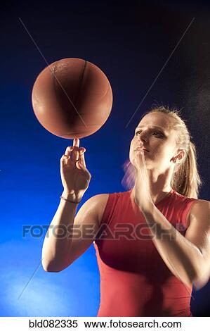Caucasian woman spinning basketball View Large Photo Image Stock Photography - Caucasian woman spinning basketball. Fotosearch