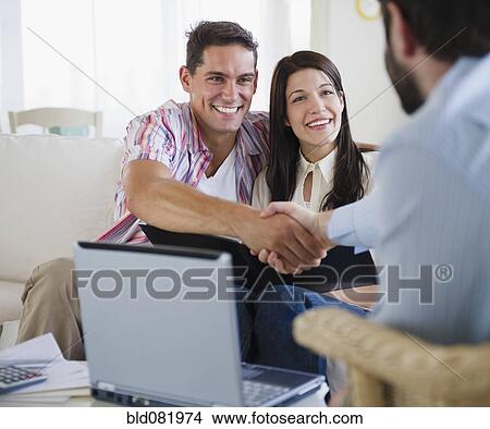 Couple greeting finance advisor View Large Photo Image Picture - Couple greeting finance advisor. Fotosearch