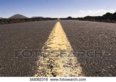 Highway through barren landscape View Large Photo Image Stock Photograph - Highway through barren landscape. Fotosearch