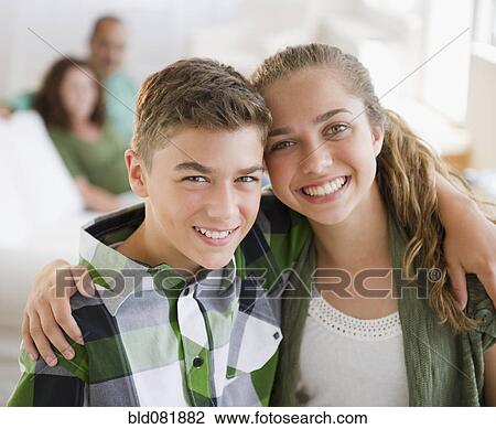 Hispanic brother and sister hugging View Large Photo Image Stock Image - Hispanic brother and sister hugging. Fotosearch