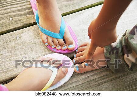Hispanic children touching feet View Large Photo Image Stock Photo - Hispanic children touching feet. Fotosearch