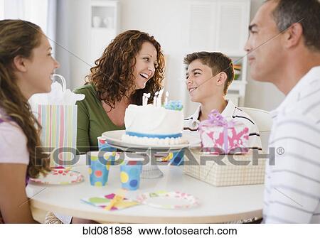 Hispanic family celebrating son's birthday View Large Photo Image Stock Photo - Hispanic family celebrating son's birthday. Fotosearch