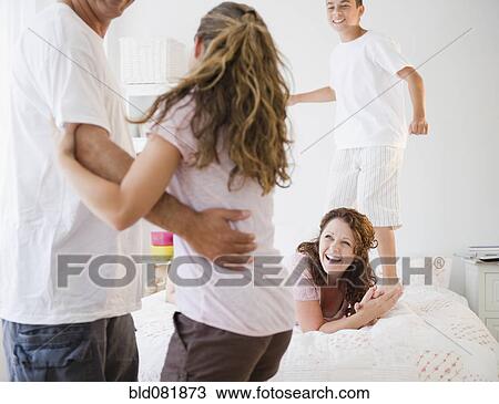 Laughing Hispanic family playing together View Large Photo Image Stock Image - Laughing Hispanic family playing together. Fotosearch