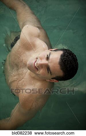 Middle Eastern man swimming View Large Photo Image Stock Photo - Middle Eastern man swimming. Fotosearch