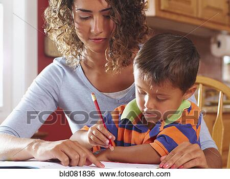 Mother helping son with homework View Large Photo Image Stock Photograph - Mother helping son with homework. Fotosearch