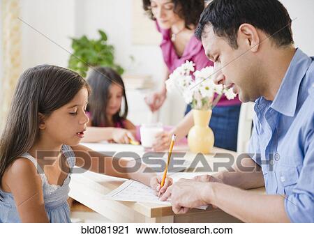Parents helping children with homework View Large Photo Image Stock Image - Parents helping children with homework. Fotosearch